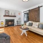 Professional results of Affordable House Cleaning in Kyle, Texas, showing a clean, bright, and tidy modern living room with spotless wooden floor.